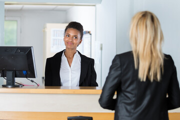 woman at counter in hotel