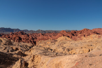 Scenic view of from Silica Dome viewpoint overlooking the Valley of Fire State Park in Mojave desert, Nevada, USA. Landscape of Aztek sandstone rock formations. Hot temperature in arid vegetation