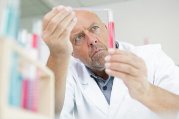 portrait of a handsome mature male lab technician concentrated