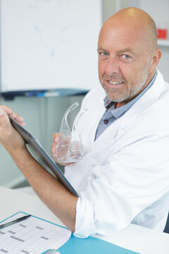 senior male researcher carrying out scientific research in a lab