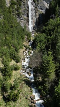 View to the dalfazer Waterfall with forest landscape and the Achensee as a close neighbor