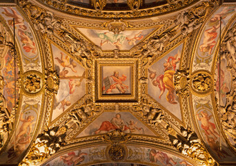 Fototapeta na wymiar MILAN, ITALY - MARCH 5, 2024: The baroque ceiling with the frescoes (virtues) in the side nave of church Chiesa di San Vittore al Corpo. 
