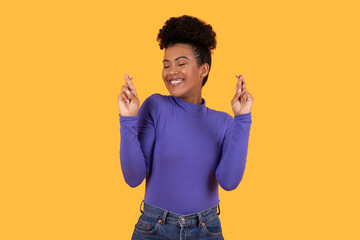 Fototapeta premium Woman in Purple Shirt Making Hand Gesture Crossed Fingers
