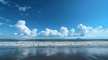 A breathtaking view of a tranquil beach landscape with majestic cumulus clouds dominating the sky