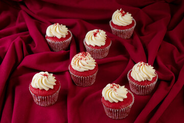Red velvet Cupcakes on a red velvet background