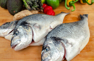 Fresh fish on a wooden board.
