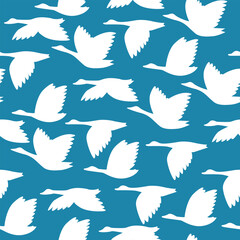 seamless pattern with silhouettes of white swans on a sky background, textile, background, decoration, design.