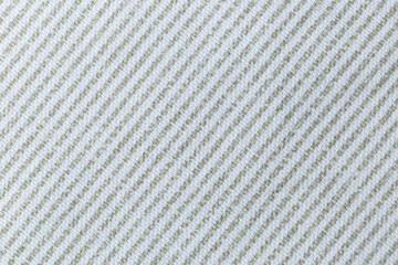 A white and green diagonal striped fabric with a pattern of squares. The fabric is very plain and...