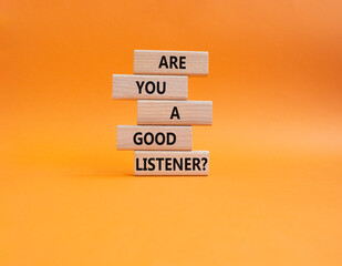 Listening skills symbol. Wooden blocks with words Are you a good Listener. Beautiful orange background. Business and Are you a good Listener concept. Copy space.