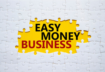 Easy Money Business symbol. Concept words Easy Money Business on white puzzle. Beautiful yellow background. Business and Easy Money Business concept. Copy space.