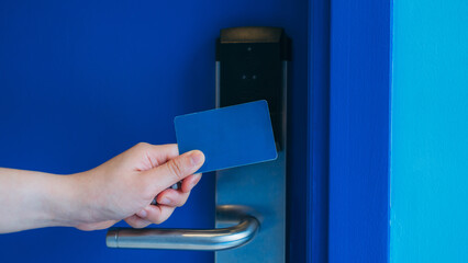 Electronic key card for unlocking hotel doors. Smart card for door access control. Concept of...