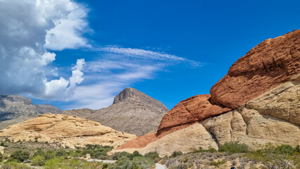 Fototapeta premium Hiking on Sandstone Quarry Overlook path with scenic view of summit Turtlehead Peak of La Madre mountains, Red Rock Canyon National Conservation Area in Mojave Deser, Las Vegas, Nevada, United States