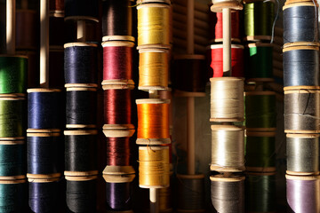 colorful spools of thread in a box