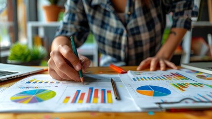 Fototapeta premium A businesswoman analyzing graphs and charts.