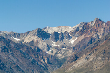 panoramic view over the Crowley lake to a iconic mountain range at a bright sunny summer day, California