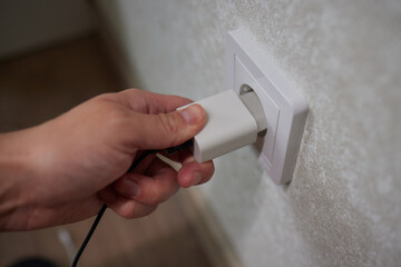Turning off appliances that are not working saves energy. Unused phone chargers or power adapters.