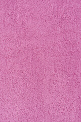 Pink plastered old wall. Abstract construction background.