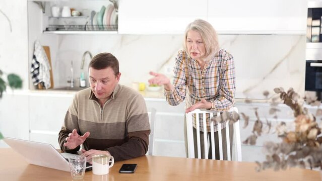 Family quarrel, mother blaming son, son is busy with laptop. Family quarrel of mother and son. High quality 4k footage