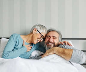 couple senior bed woman man home wife husband love together elderly caucasian adult happy...