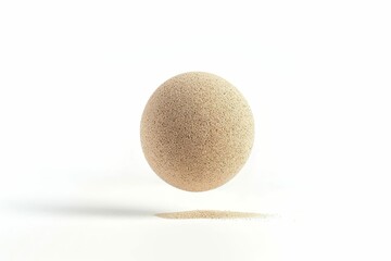 kinetic sand ball levitating on white background abstract photo