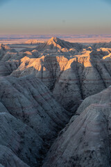 Fototapeta na wymiar Geological Rock Formations hightlighted by the sun in the early morning hours in South Dakota's Badlands National Park in Spring