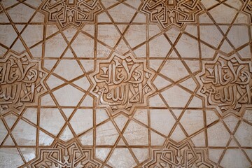 The image is a close up of a tile floor with a pattern of stars