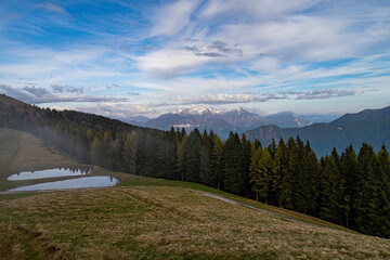 Alpine landscape in a foggy day on Lake Como Alps