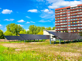 Solar panels installed in a residential housing estate. Green energy for the residents, promoting...