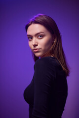 Young beautiful smart woman over purple isolated background happy face smiling Positive person.