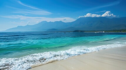 An idyllic tropical scene with clear waters, pristine beach sands, and a dramatic mountain backdrop under blue skies