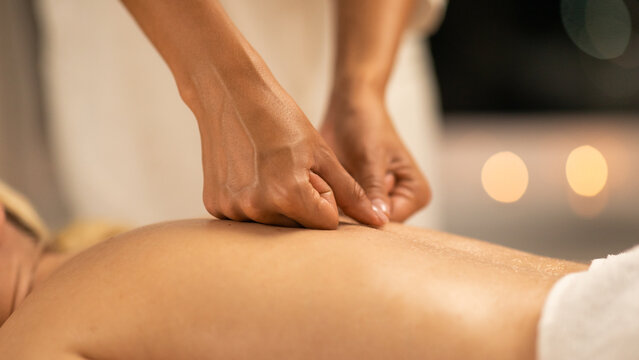 Woman Receiving Back Massage at Spa, Closeup