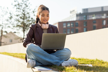 Girl Sitting on Bench Using Laptop Computer
