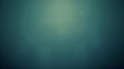 Underwater view with floating particles and blue-green hues