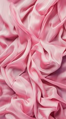 Obraz premium A pink fabric with a wave pattern. The fabric is soft and smooth to the touch. The color pink is vibrant and eye-catching, making the fabric stand out