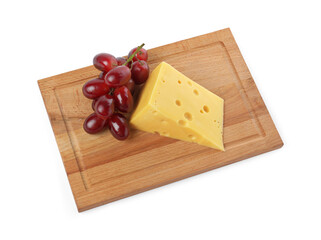 Piece of delicious cheese and grapes isolated on white, above view