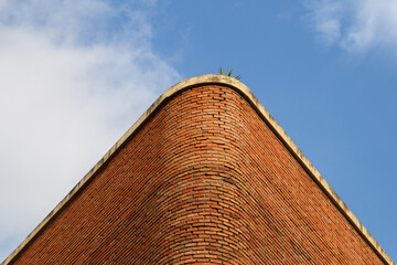 architecture in Barcelona city in Spain, brick wall and blue sky