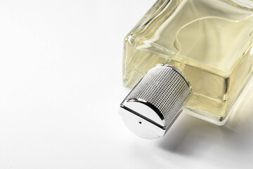 Luxury men`s perfume in bottle on white background, closeup. Space for text