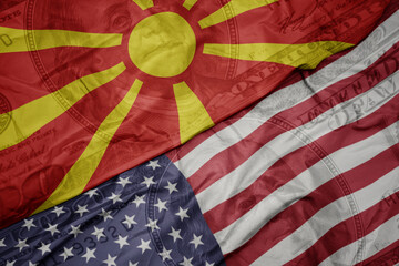 waving colorful flag of united states of america and national flag of macedonia on the dollar money background. finance concept. macro