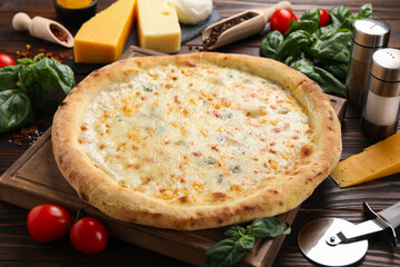 Delicious cheese pizza and ingredients on wooden table