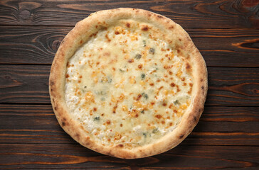 Delicious cheese pizza on wooden table, top view