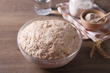 Fresh sourdough in bowl on wooden table, closeup
