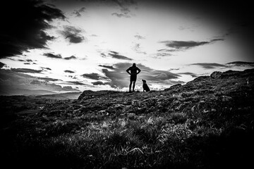 running at dusk silhouette of runner in the Lake District National park - obrazy, fototapety, plakaty