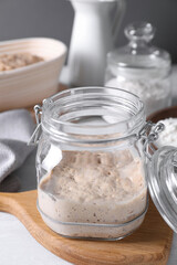 Sourdough starter in glass jar on light table