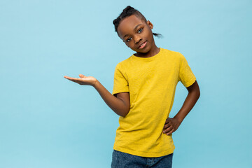 African american kid in yellow thsirt on blue background