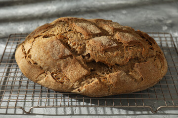 Freshly baked sourdough bread on grey table