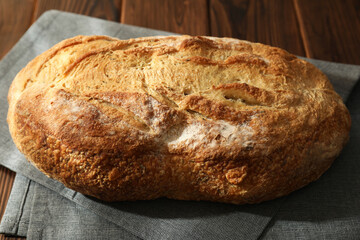 Freshly baked sourdough bread on wooden table