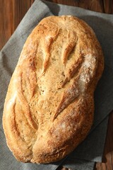 Freshly baked sourdough bread on wooden table