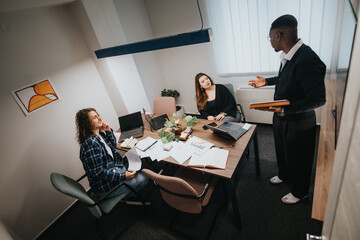 Three diverse coworkers actively engaged in a business meeting, analyzing growth statistics and discussing company sales in an office environment.