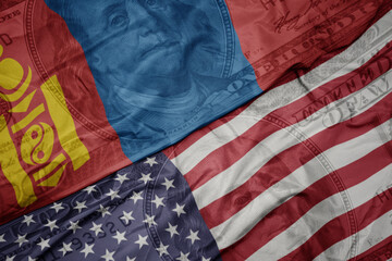 Obraz premium waving colorful flag of united states of america and national flag of mongolia on the dollar money background. finance concept.