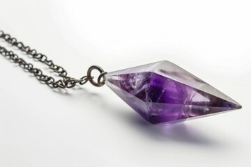 A stunning amethyst crystal displayed on a delicate chain. Perfect for jewelry or spiritual themes